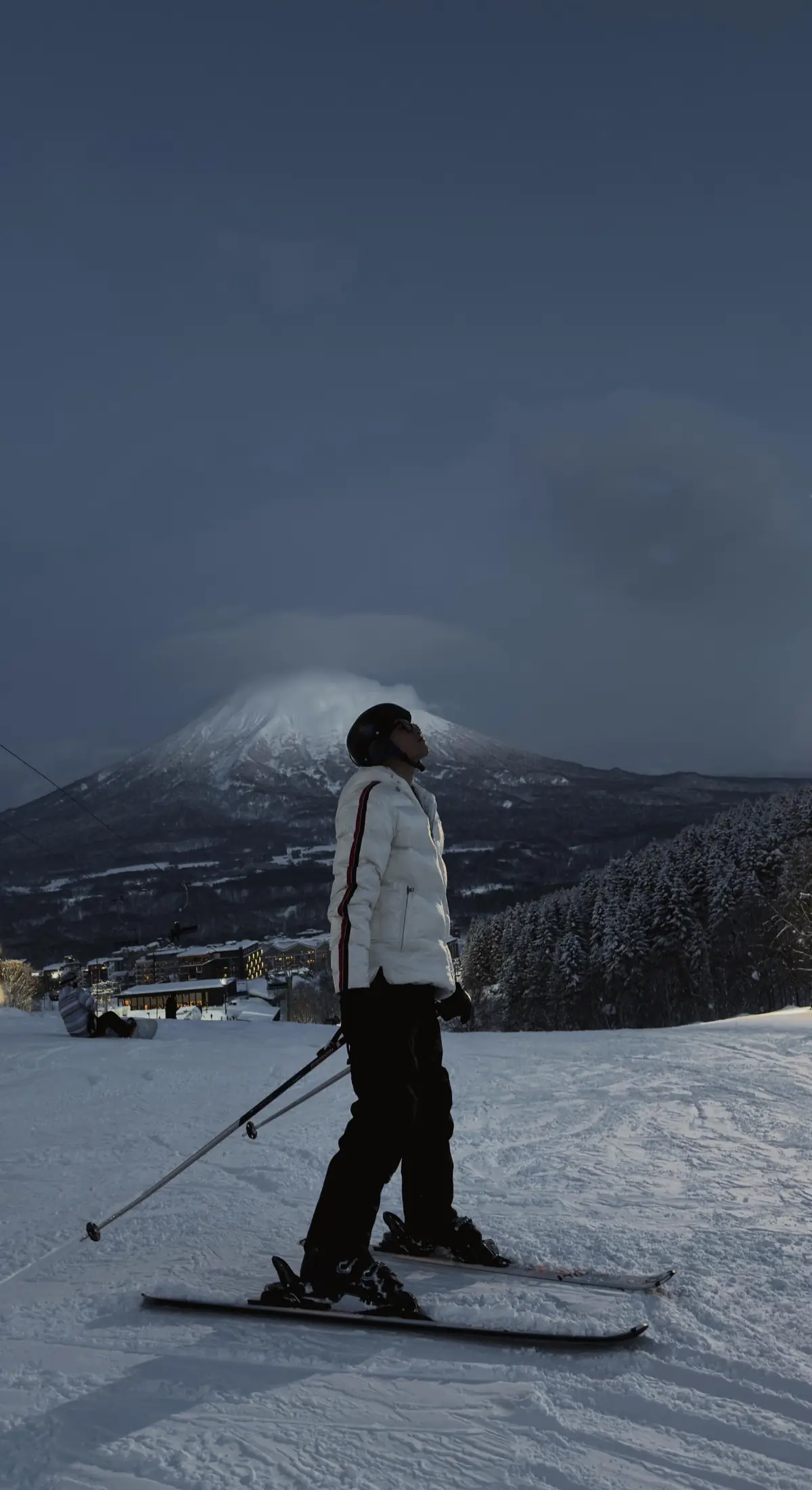Vatana Pang skiing with a mountain view